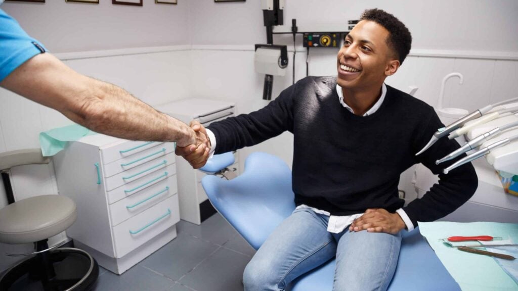 Man shaking hand with their endodontist
