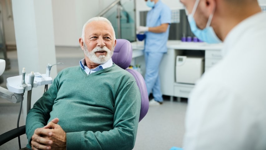 Male patient in dentist chair
