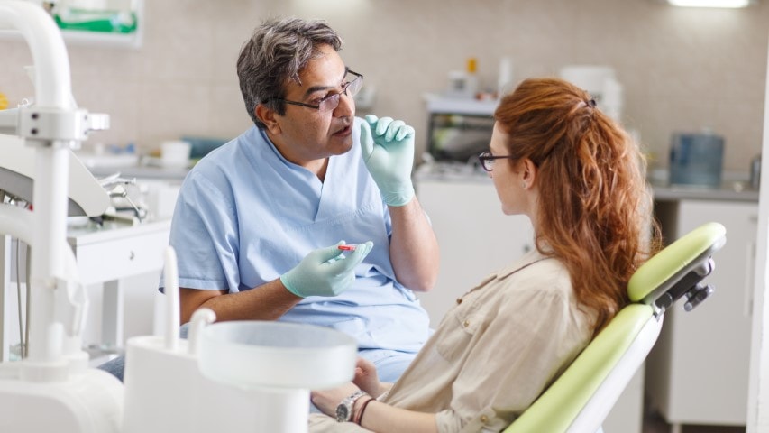 Endodontist talking with a patient.